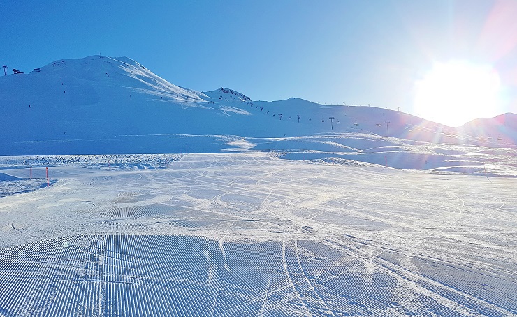 Groomed ski runs on a bright sunny day - Davos Ski Resort Switzerland